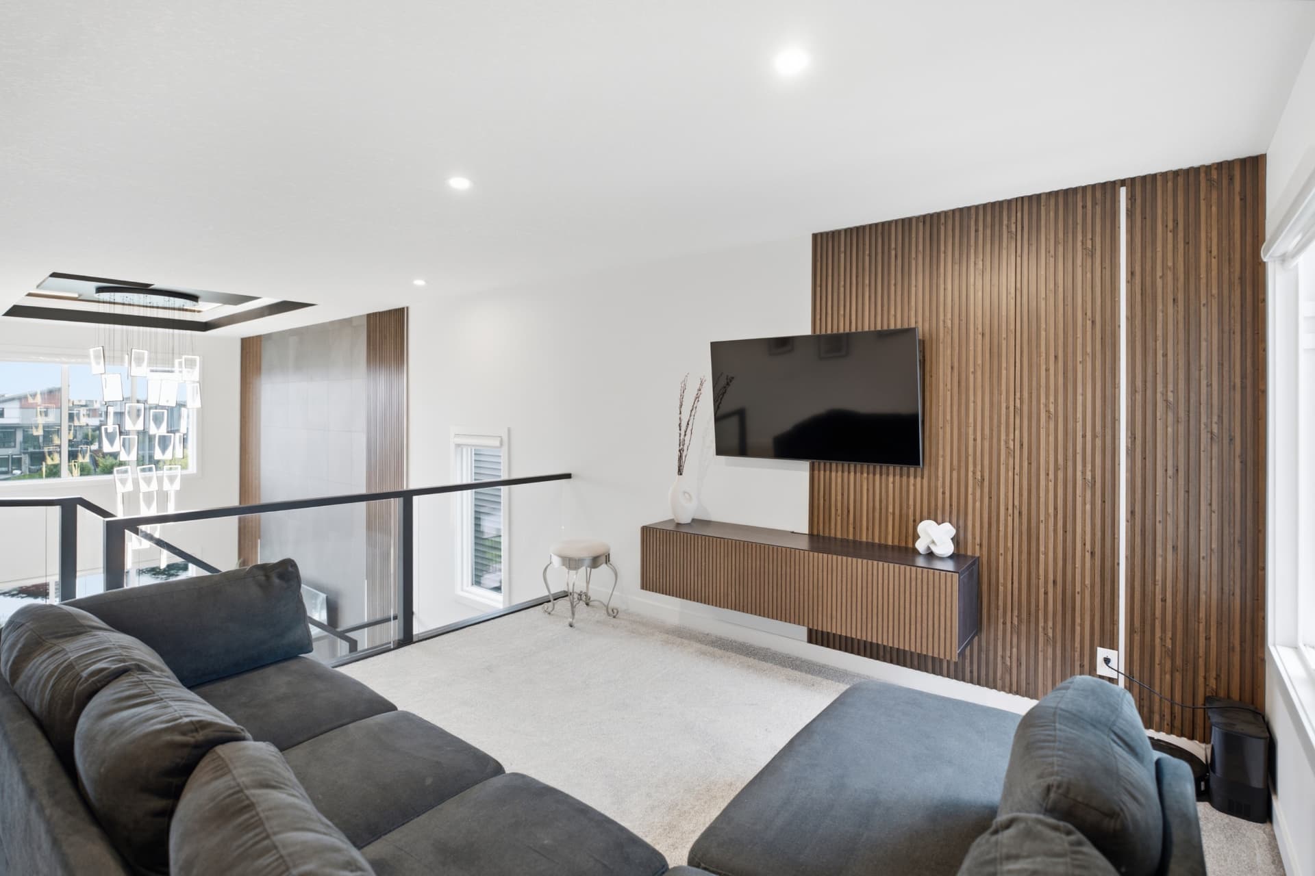 Upper bonus room with slat wood feature wall