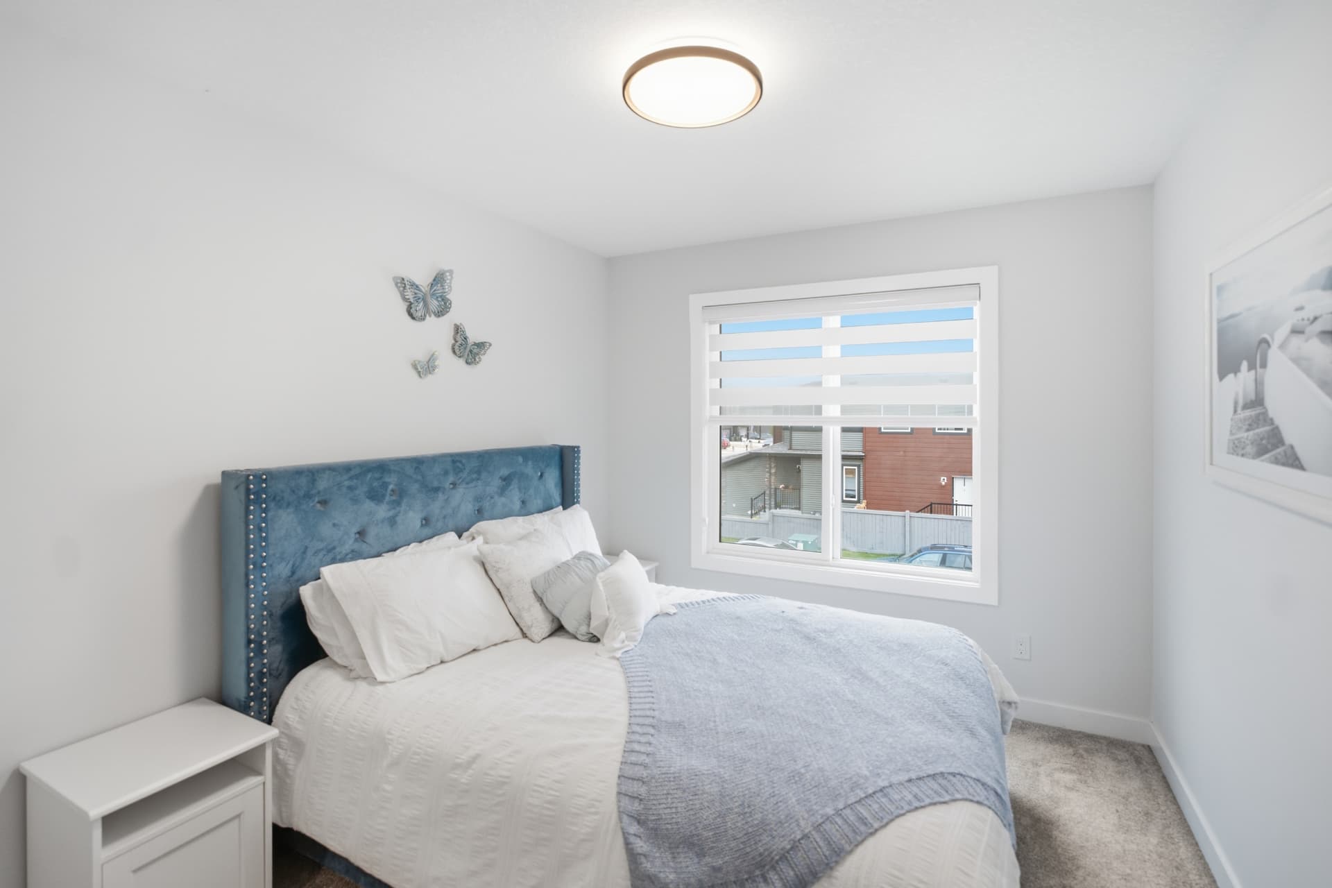Secondary bedroom with upholstered headboard