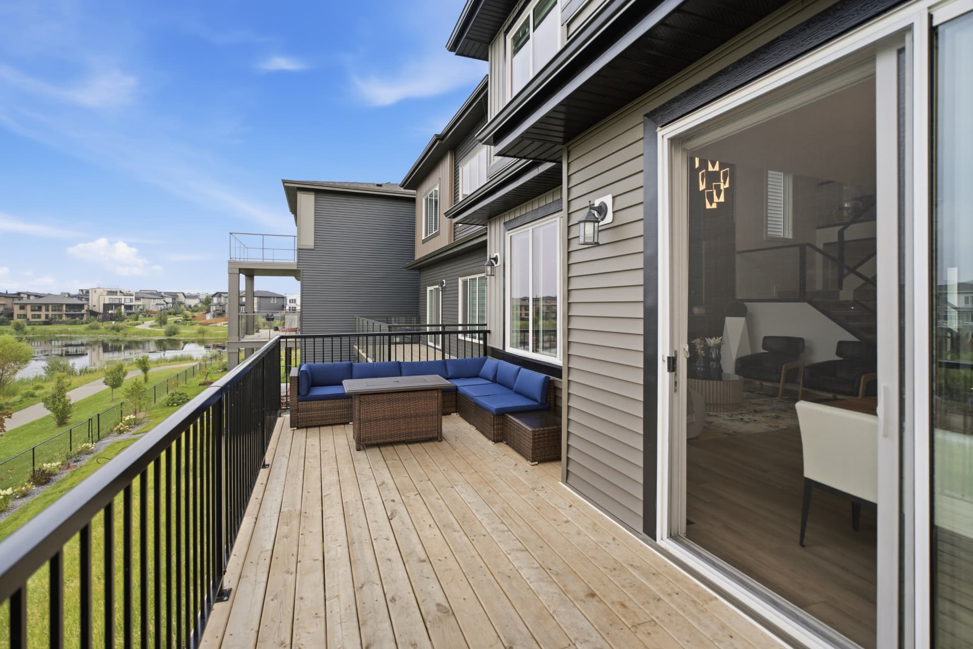 Rear deck with patio seating and pond view
