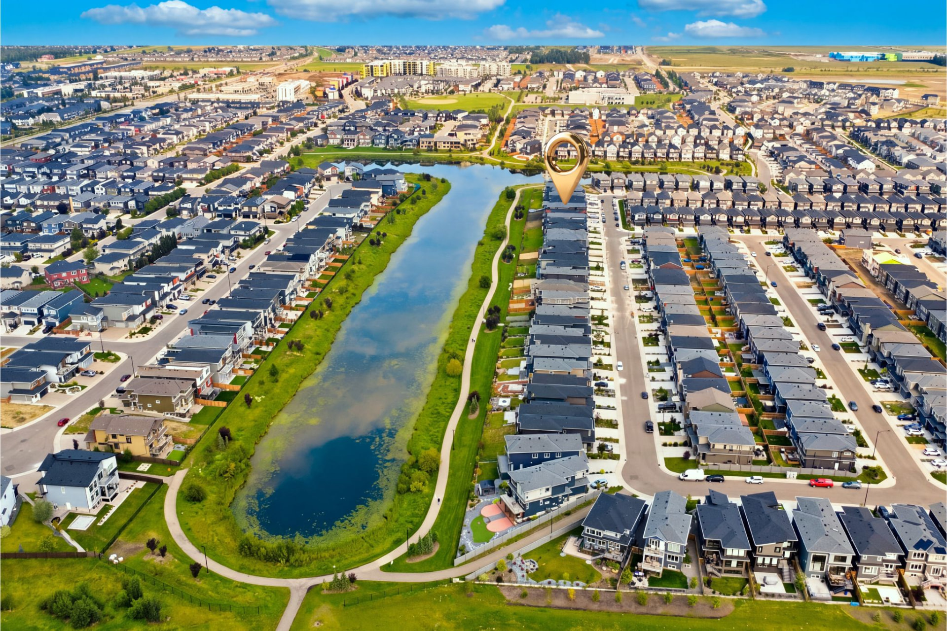 Aerial neighbourhood photograph with pond and green space
